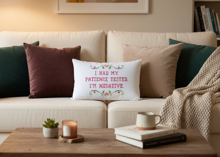 Decorative pillow with text on a couch in a living room setting