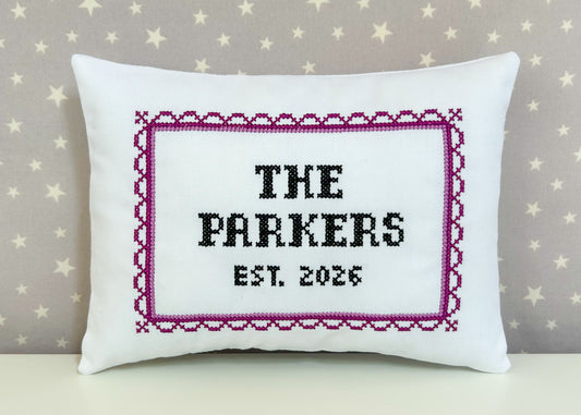 Decorative pillow with 'The Parkers Est. 2026' text on a star-patterned background