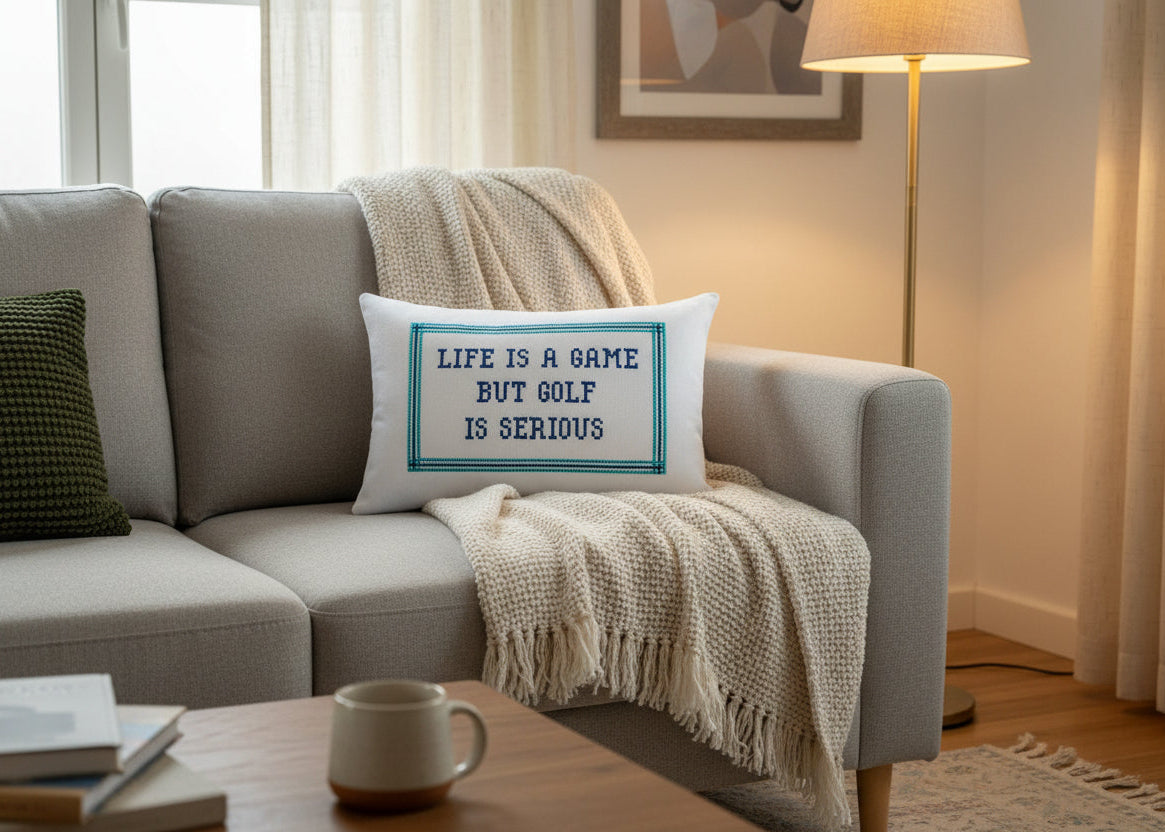 Living room with a gray sofa, coffee table, and decorative pillow with text.