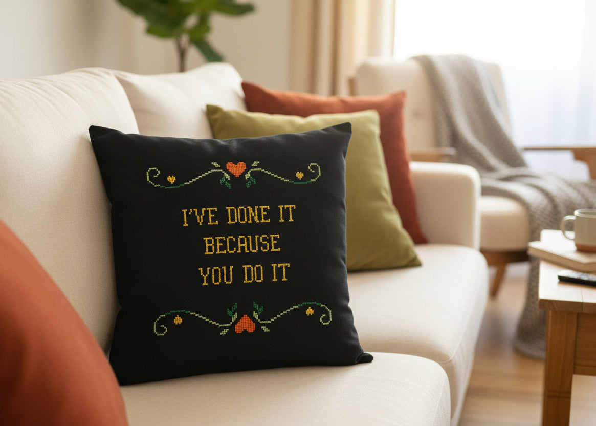 Decorative pillow with text on a couch in a living room setting