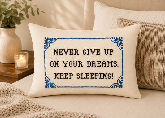 Decorative pillow with motivational quote on a bed.