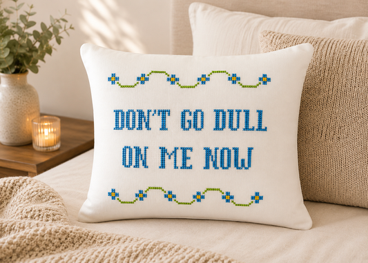 Decorative pillow with text on a bed in a bedroom