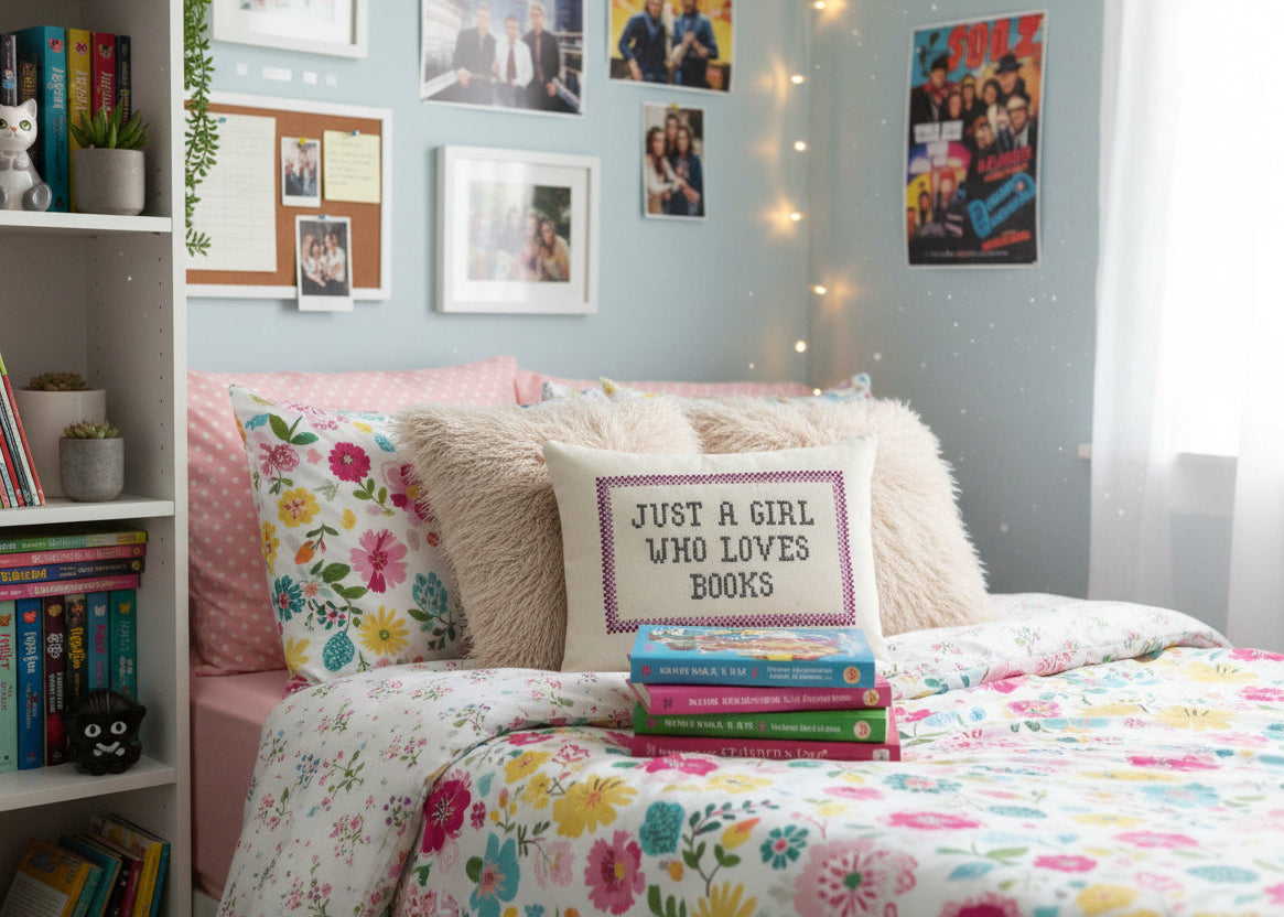 Bedroom with floral bedding, books, and decorative pillows.