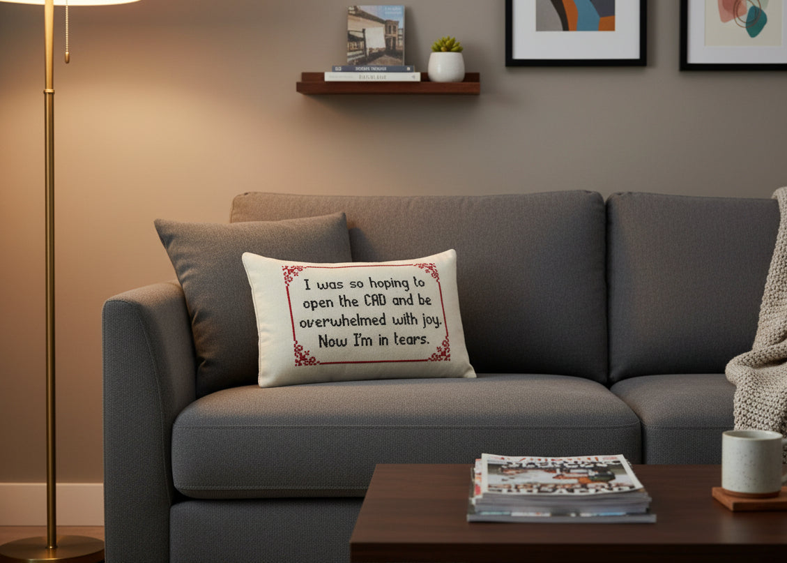Gray sofa with a decorative pillow in a living room setting