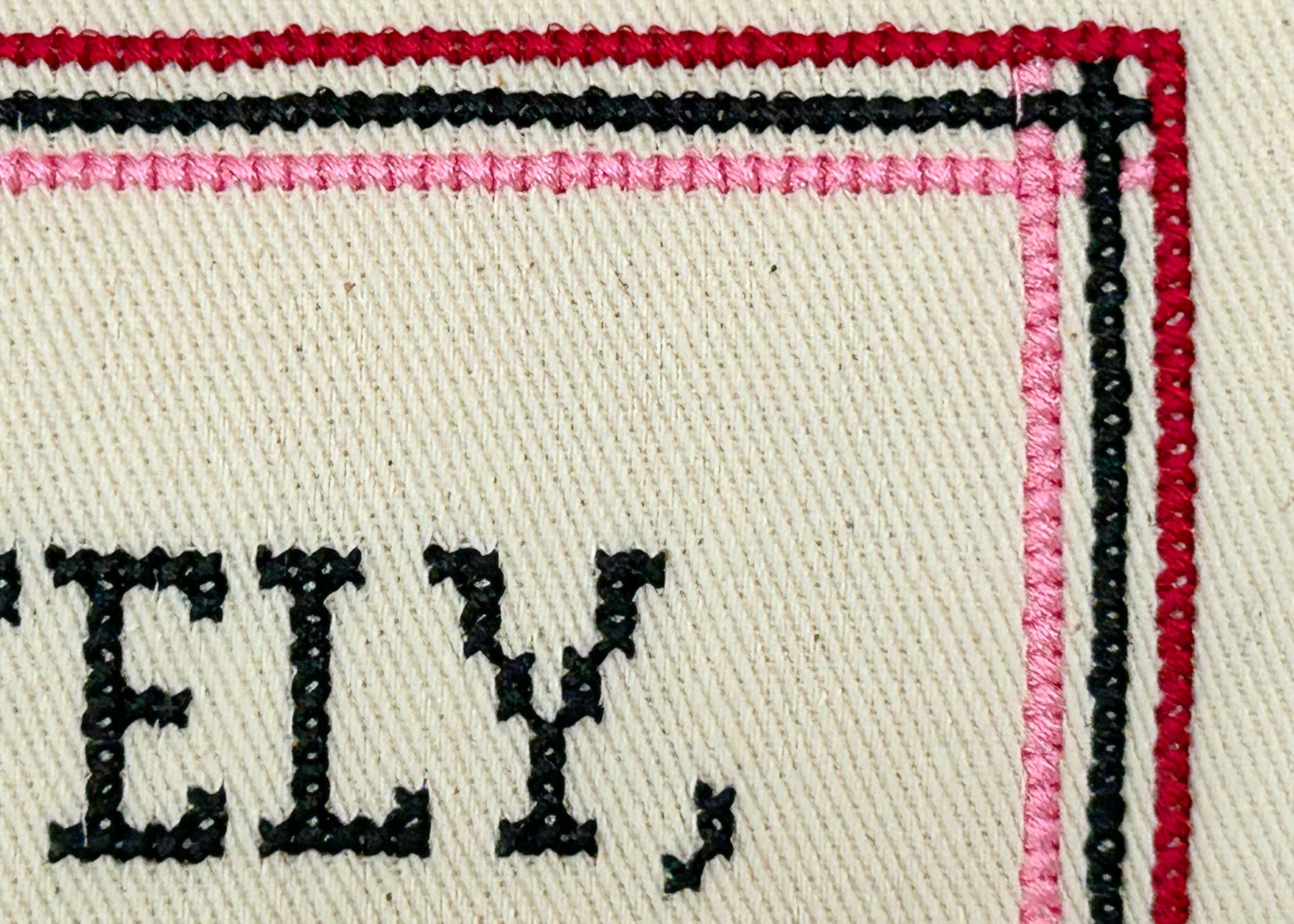 Close-up of a label with the word 'FELLY' embroidered on it.