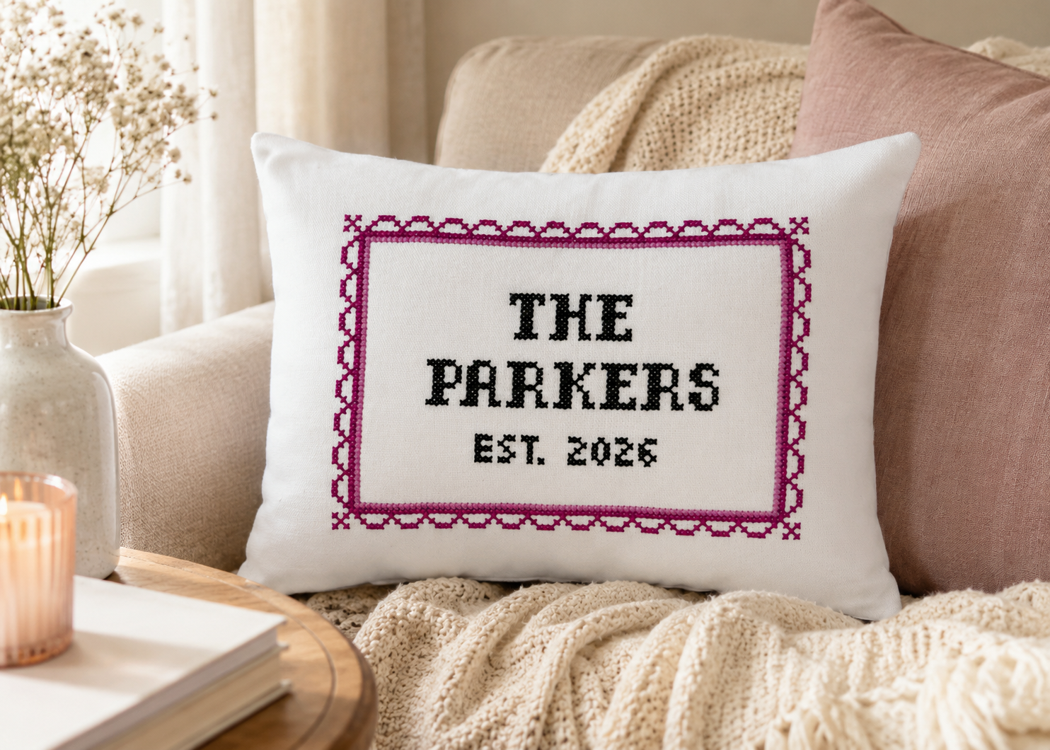 Decorative pillow with 'The Parkers Est. 2026' text on a couch.