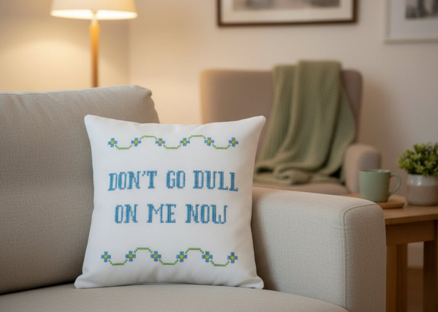 Decorative pillow with text on a couch in a living room setting